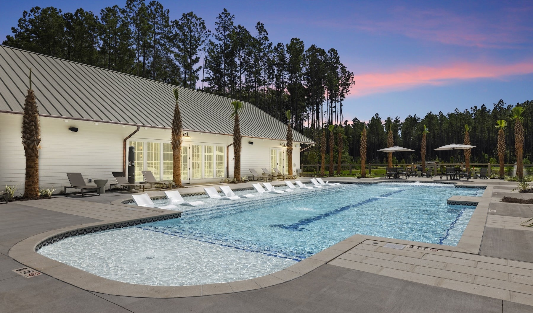 pool with modern stonework and reclining seats