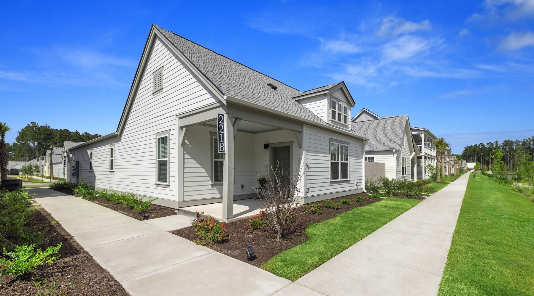 exterior of building showing the property's lush landscaping