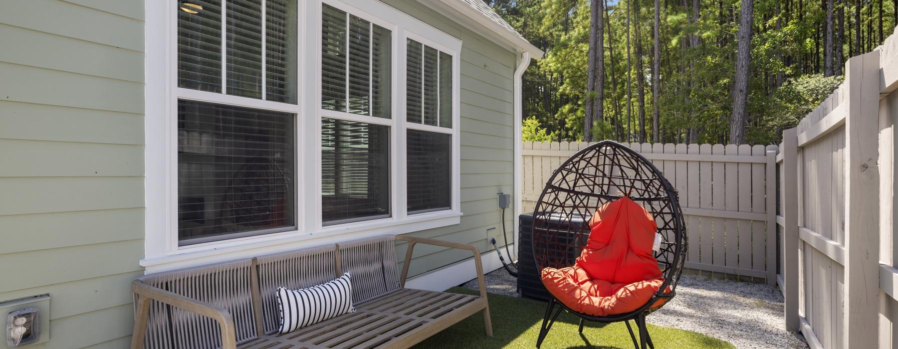 a chair and bench in a backyard
